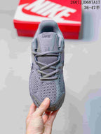 Top view of the gray Nike V5 RNR sneaker showing the mesh toe box, laces, tongue, and padded collar.