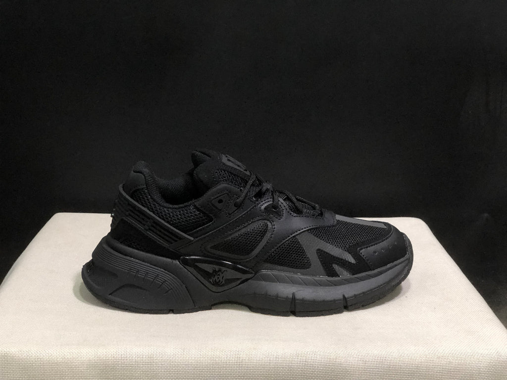 Outer side profile showing the layered upper, lace eyelets, heel structure, and rubber outsole.
