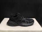 Outer side profile showing the layered upper, lace eyelets, heel structure, and rubber outsole.