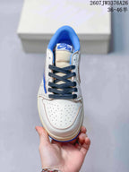 Top-down view showing the perforated white toe box, dark laces, and blue collar.