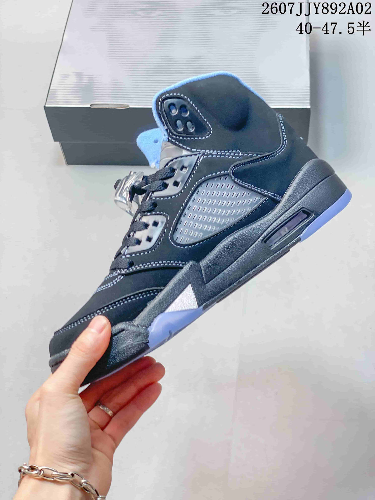 Side view showing the sneaker's perforated side panel, contrast stitching and translucent outsole