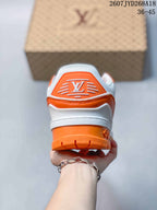 Rear view showing the white and orange heel structure and branded heel detail.