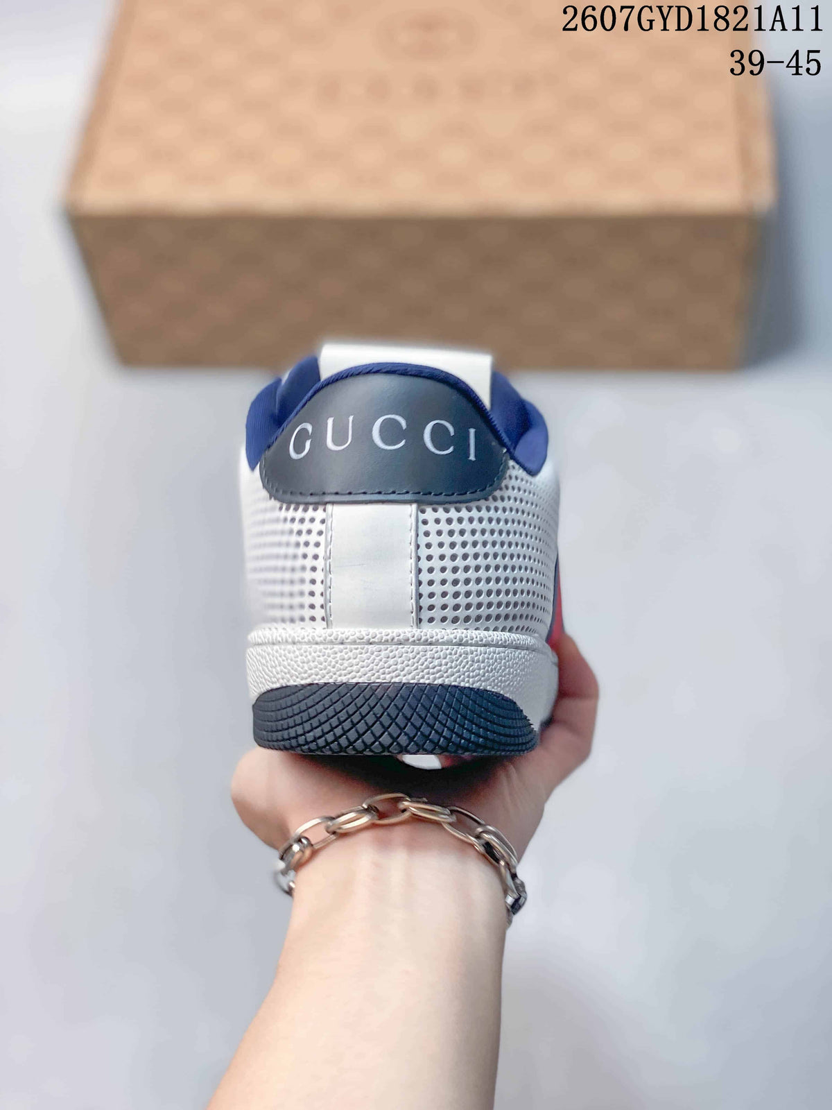 Rear view showing the white perforated heel, navy collar lining, and Gucci branding.