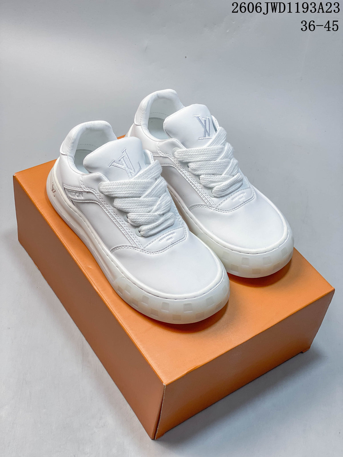 Pair of white Louis Vuitton Tilted low-top sneakers with wide laces and chunky soles