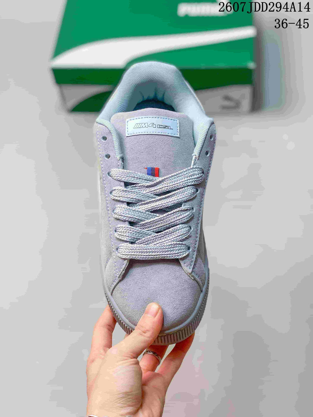 Top view of the lace-up sneaker showing the tonal laces, padded tongue and Suede XL label; the image shows size range 36-45.