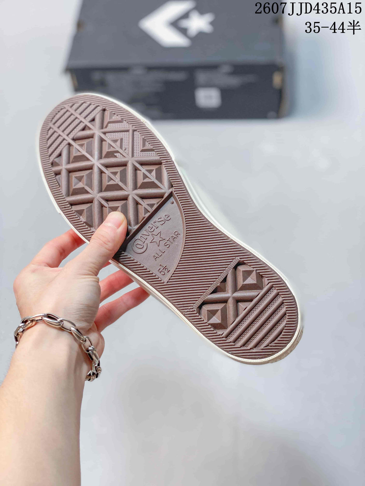 Close-up of the patterned rubber outsole showing Converse One Star branding.