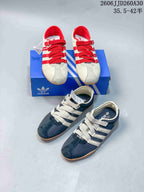 Cream and red and navy and cream Tokyo MJ sneaker pairs shown together.