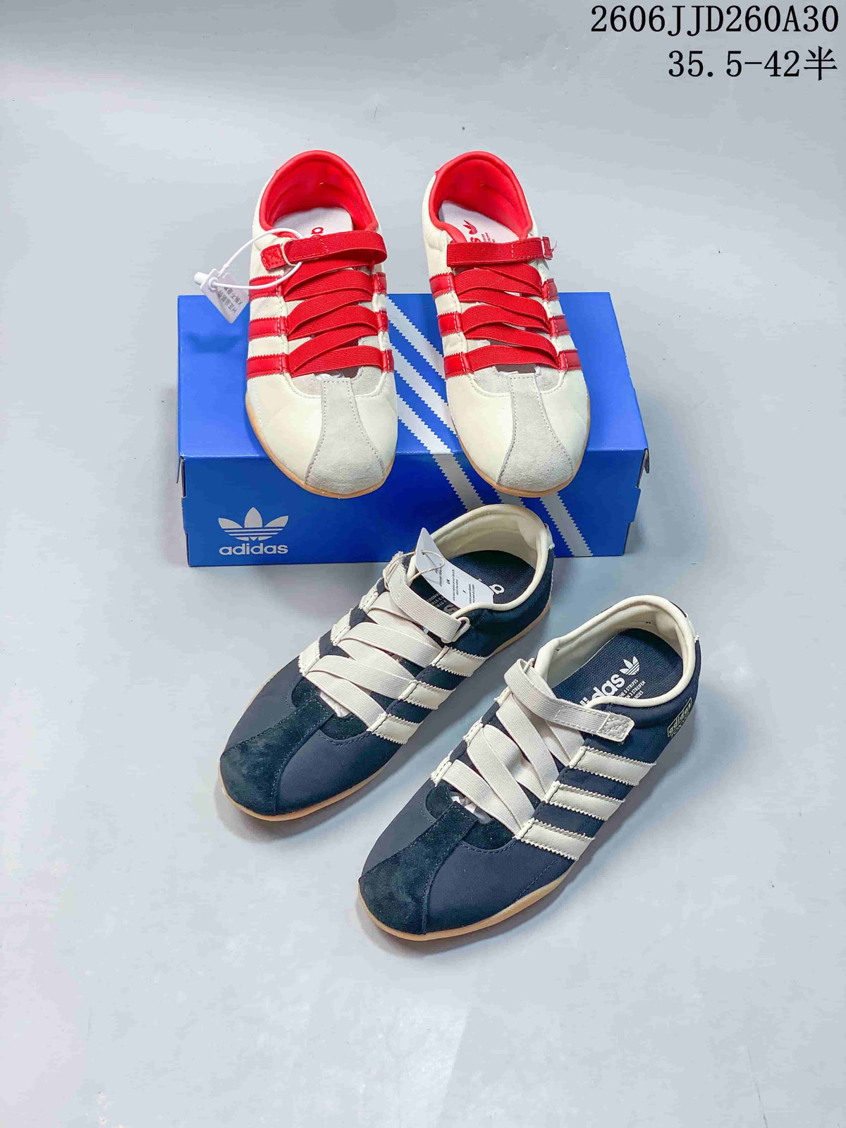 Cream and red and navy and cream Tokyo MJ sneaker pairs shown together.