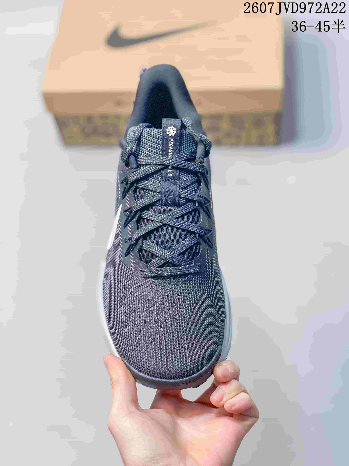 Front view showing the rounded toe, mesh-style upper, tongue, and lacing system.