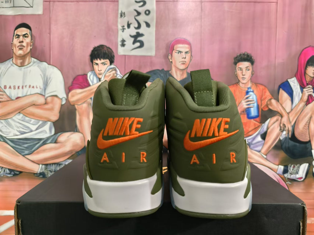 Rear view of olive green Jordan high-top sneakers with orange Nike Air branding and white midsoles