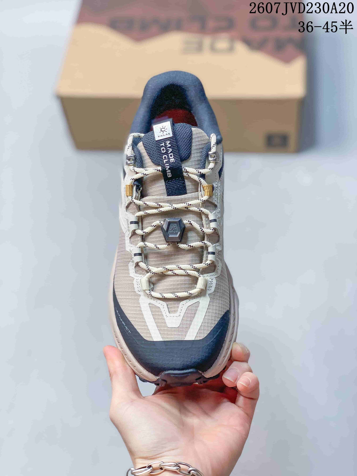Top view showing the lace arrangement, metal hardware, padded tongue, and protective toe overlay.