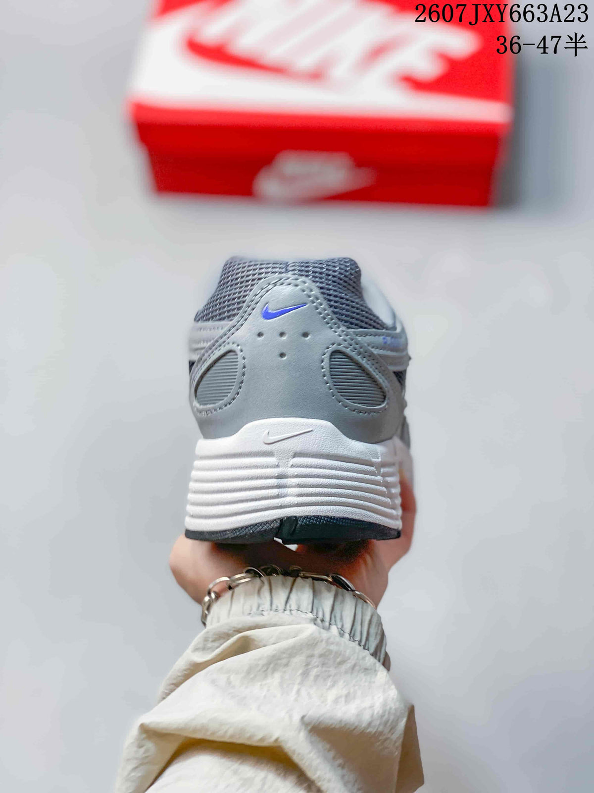 Rear view of a gray Nike P-6000 sneaker with a layered heel and white midsole.