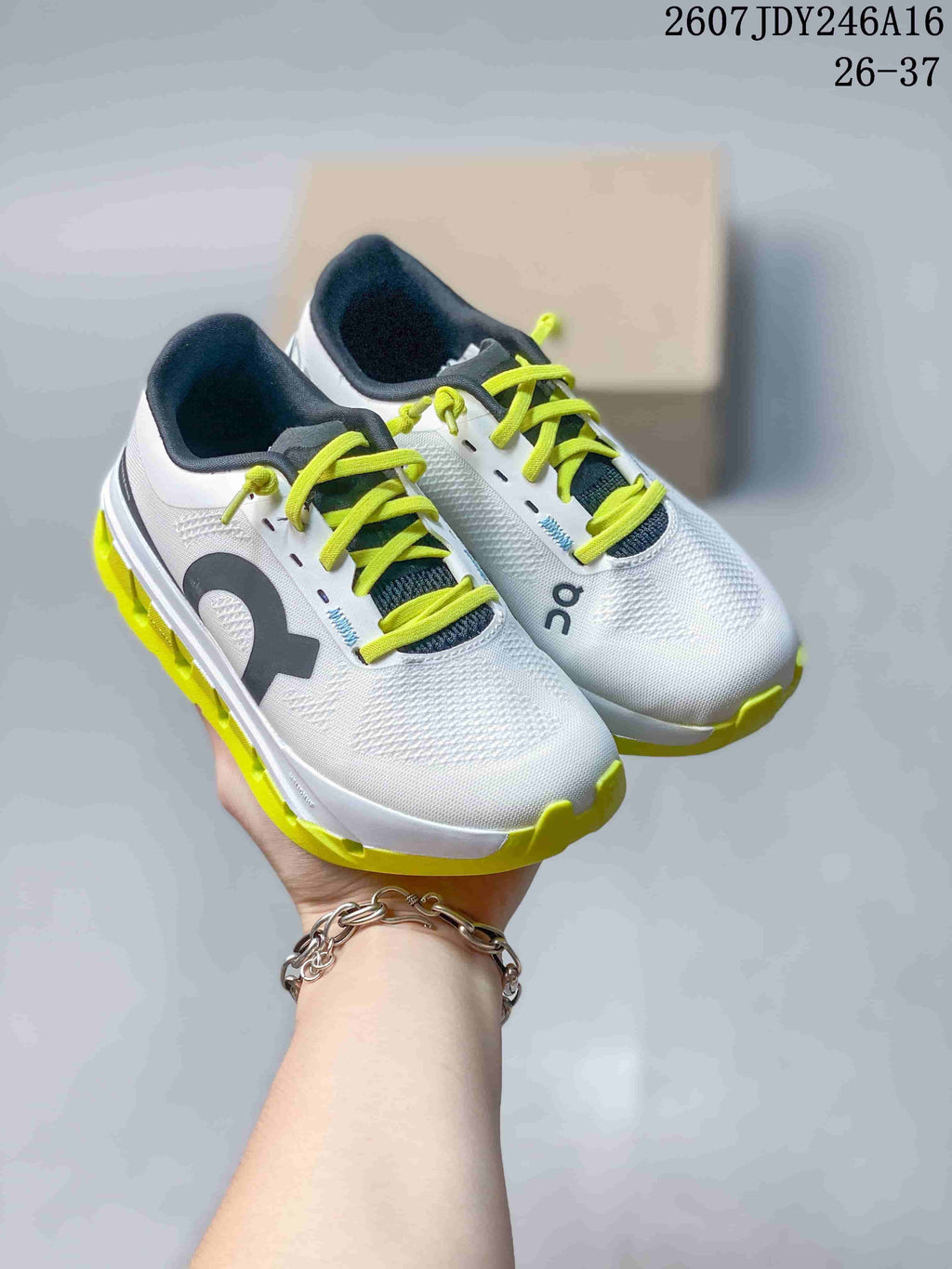 Pair of white On Cloudstratus 3 kids' shoes with black collars, lime laces, and bright lime outsoles.
