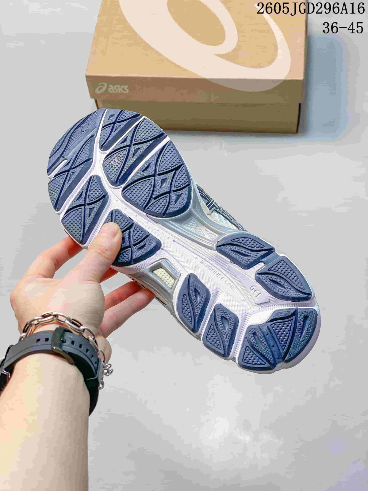 Underside of an ASICS Gel-Cumulus 16 sneaker showing a navy and white patterned outsole.