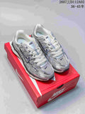 Pair of silver-toned Nike P-6000 sneakers displayed on a red shoe box