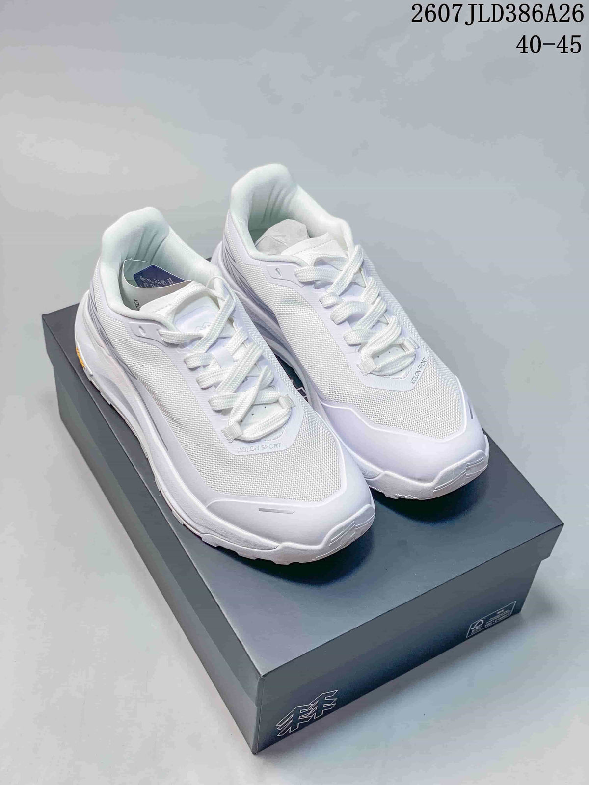 Pair of white KOLON SPORT sneakers displayed on a shoebox, with the product code and size range visible above.