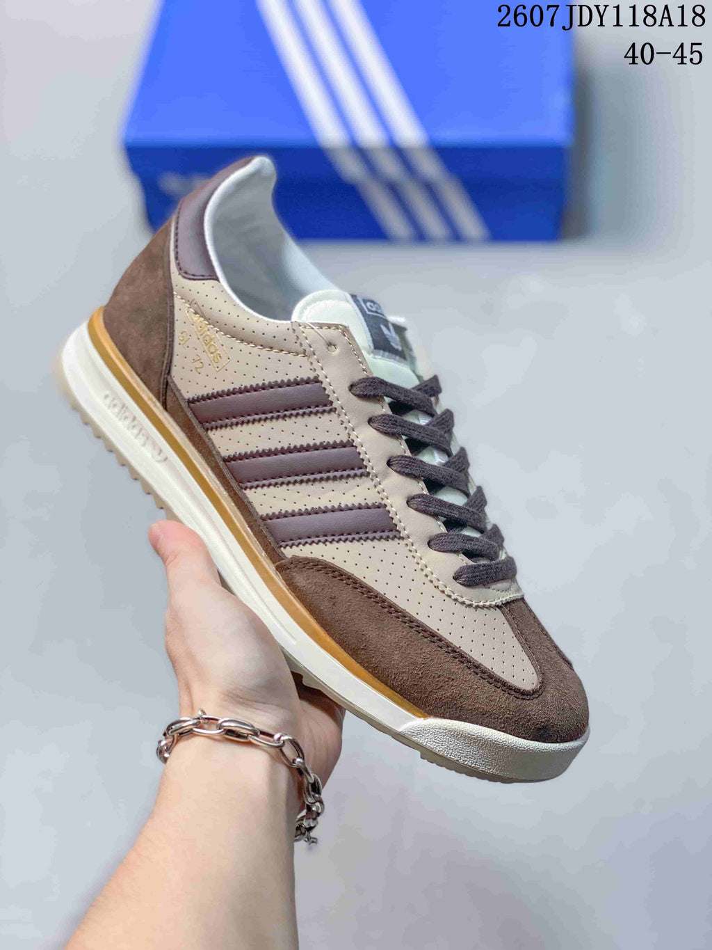 Cream, brown and dark gray adidas SL 72 sneaker with a gum-colored outsole.