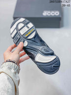 Close-up of the sneaker outsole showing a sculpted tread pattern with contrasting light sections and visible BIOM branding.