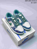 Pair of blue, white and green Nike-marked low-top sneakers displayed on a shoebox, with style code JDD1353A13 and size range 36–45 visible.