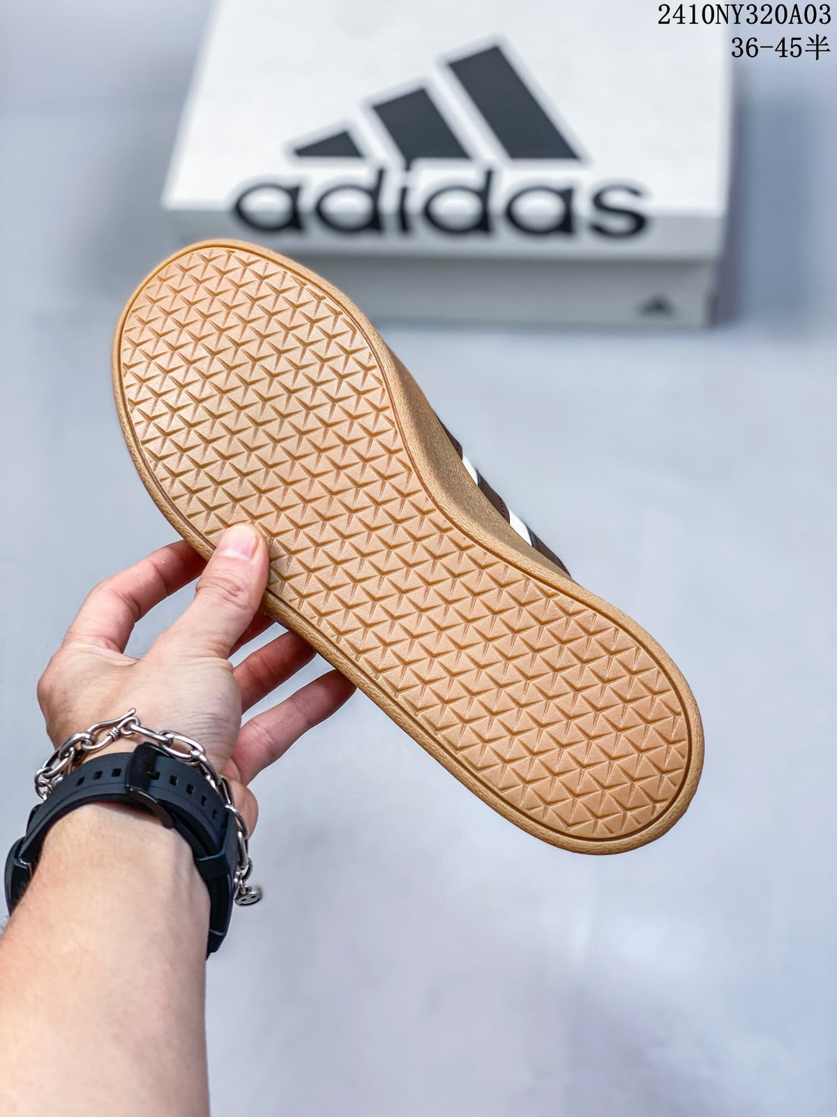Close view of the sneaker outsole showing a gum-colored geometric tread pattern.