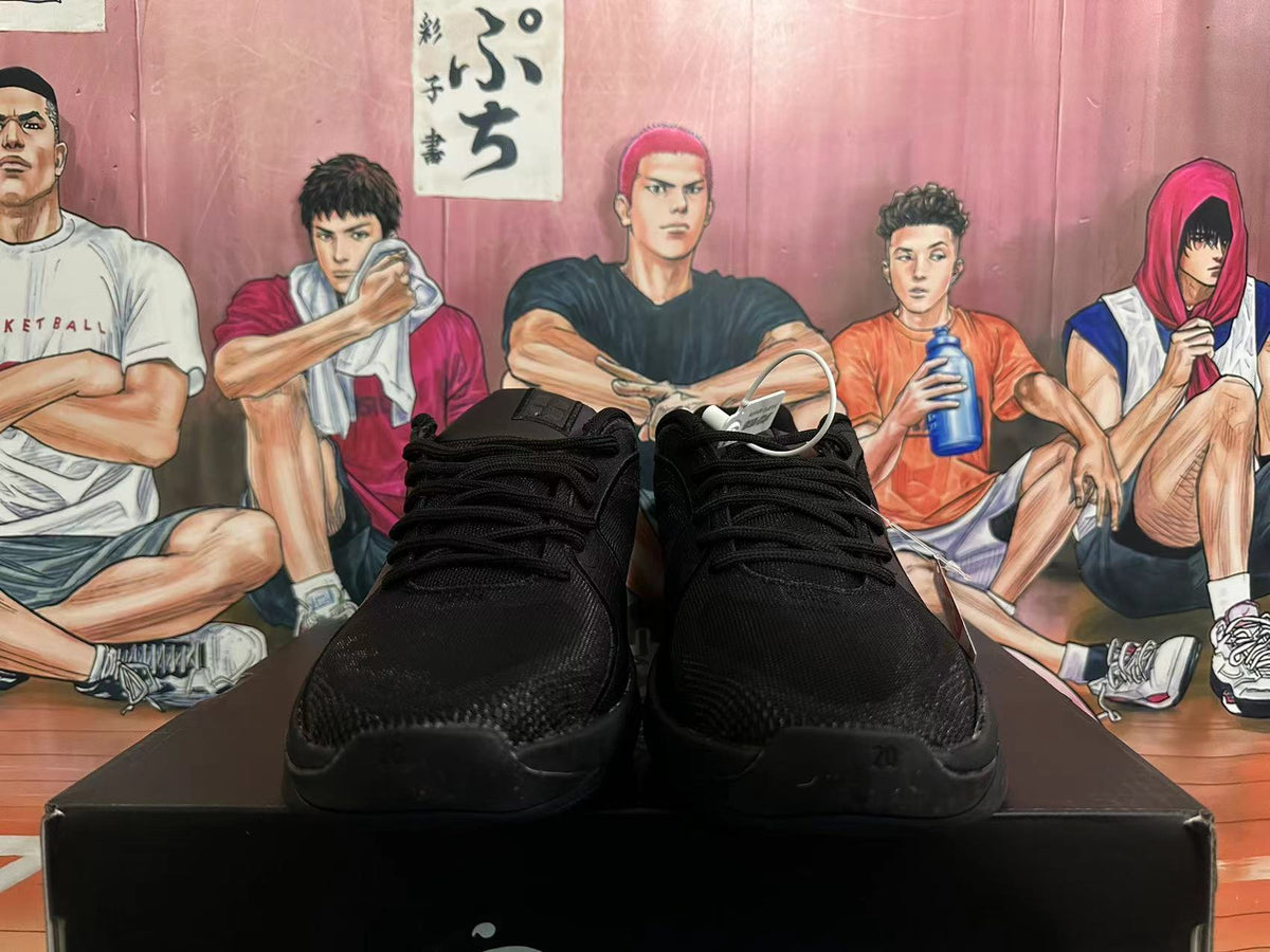 Front view of black Nike basketball shoes with laces