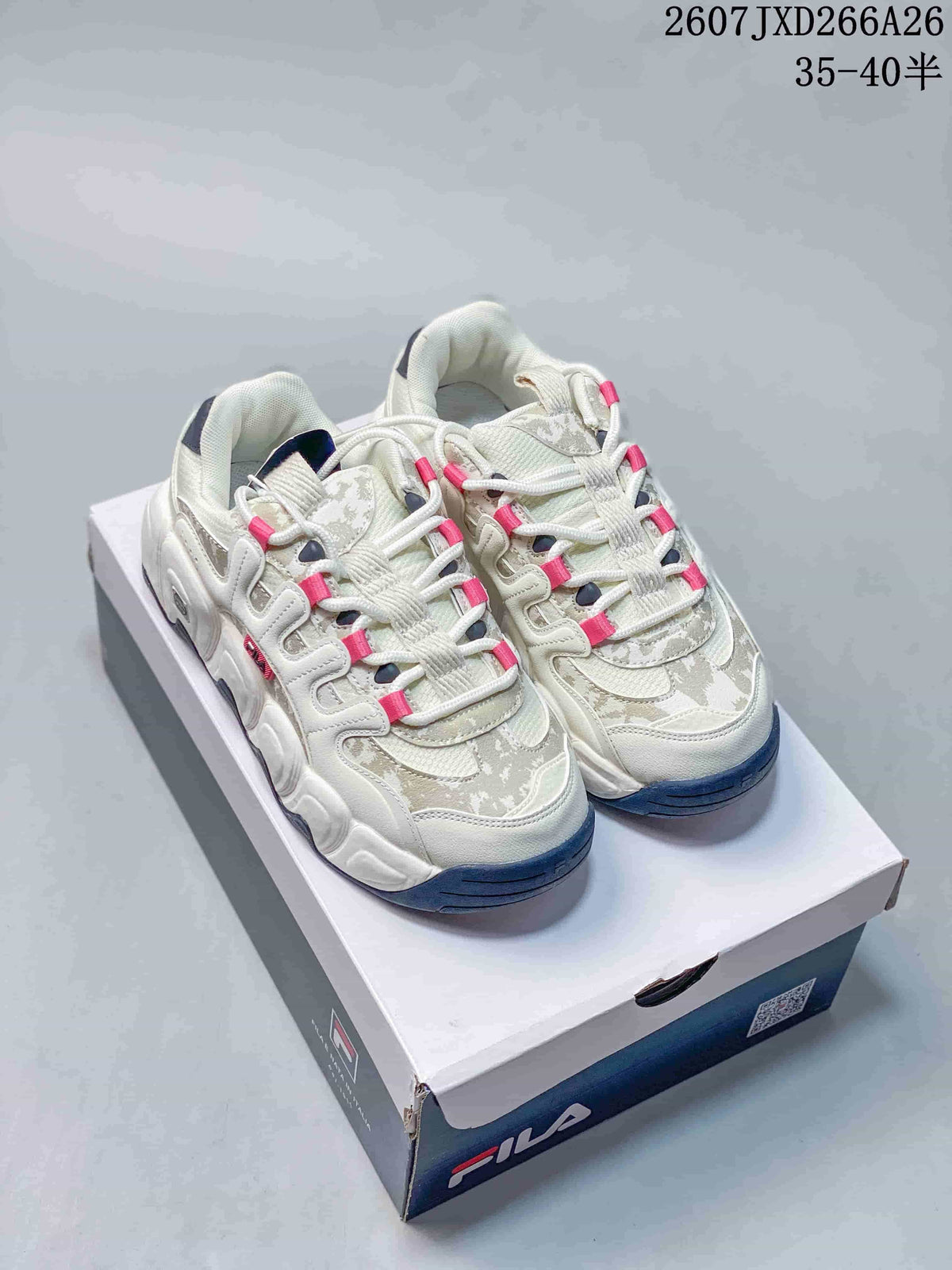 Pair of white and gray FILA Croissant sneakers with pink lace accents displayed on a FILA shoebox; overlay text shows style reference 2607JXD266A26 and sizes 35–40.5.