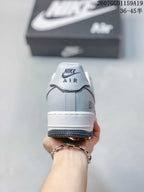 Rear view showing the Nike Air heel logo, layered heel panel, and white midsole.