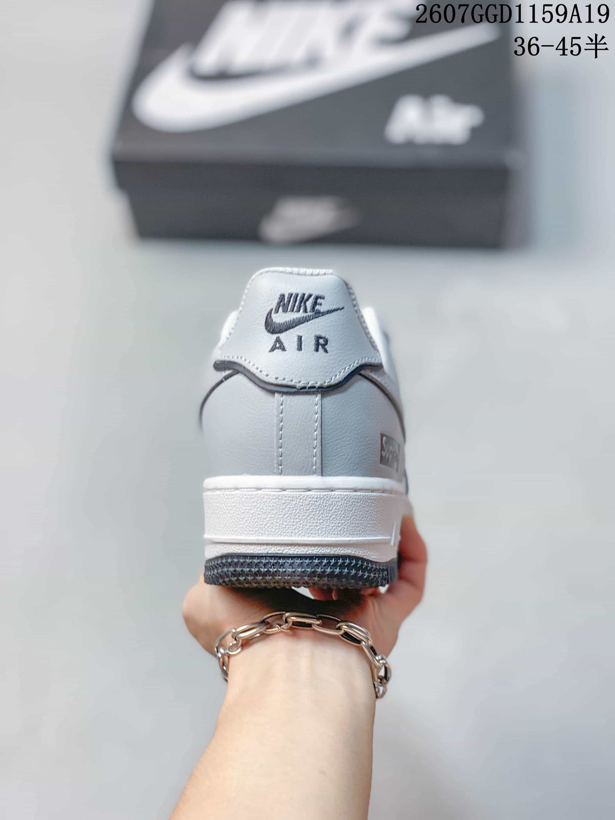 Rear view showing the Nike Air heel logo, layered heel panel, and white midsole.