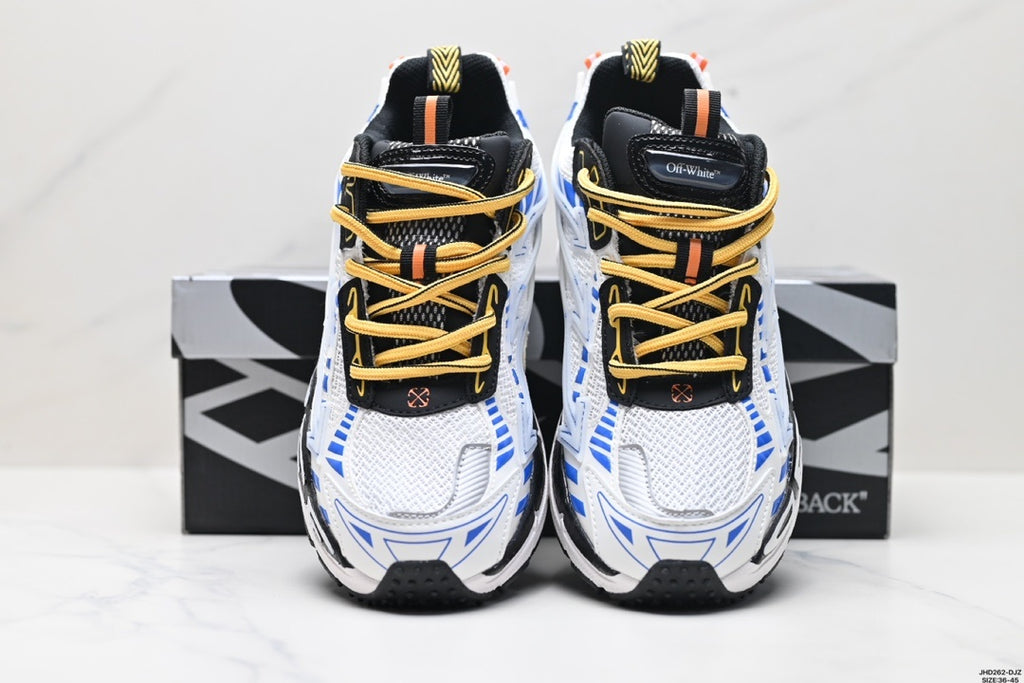 Front view of the pair showing the white mesh toes, yellow laces, black tongues, and blue detailing.