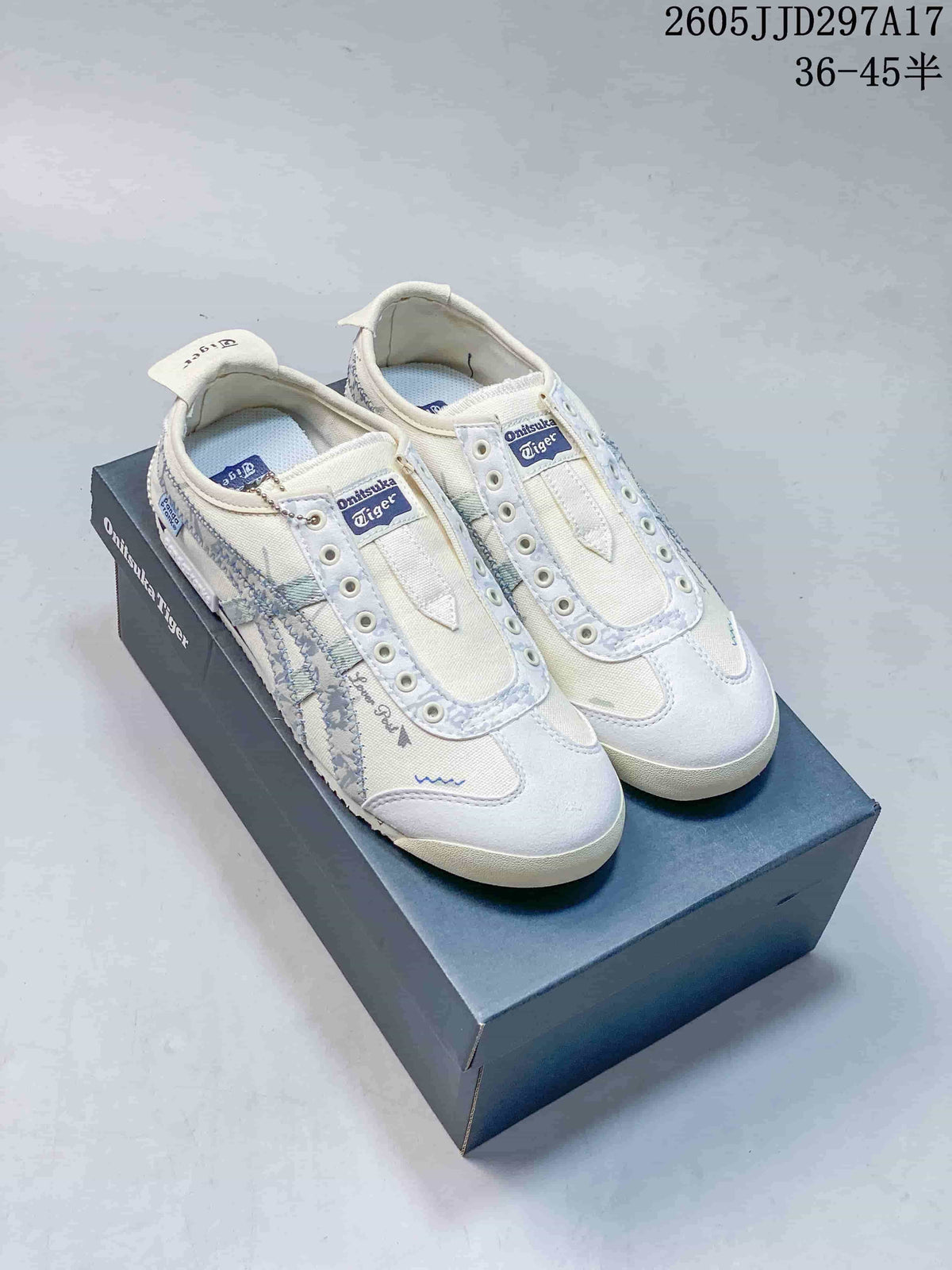 Pair of off-white and pale blue Onitsuka Tiger Mexico 66 Deluxe sneakers displayed on a branded shoebox; JJD297A17 and the size range 36–45.5 are visible.