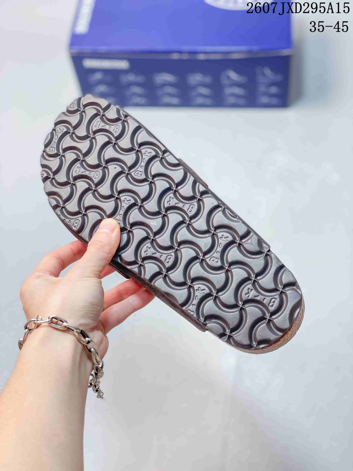 Close-up of the patterned outsole showing a repeating tread motif on the clog sole.