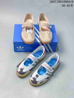 Both photographed colorways of the Adidas Samba Jane W sneaker arranged with an Adidas shoebox.