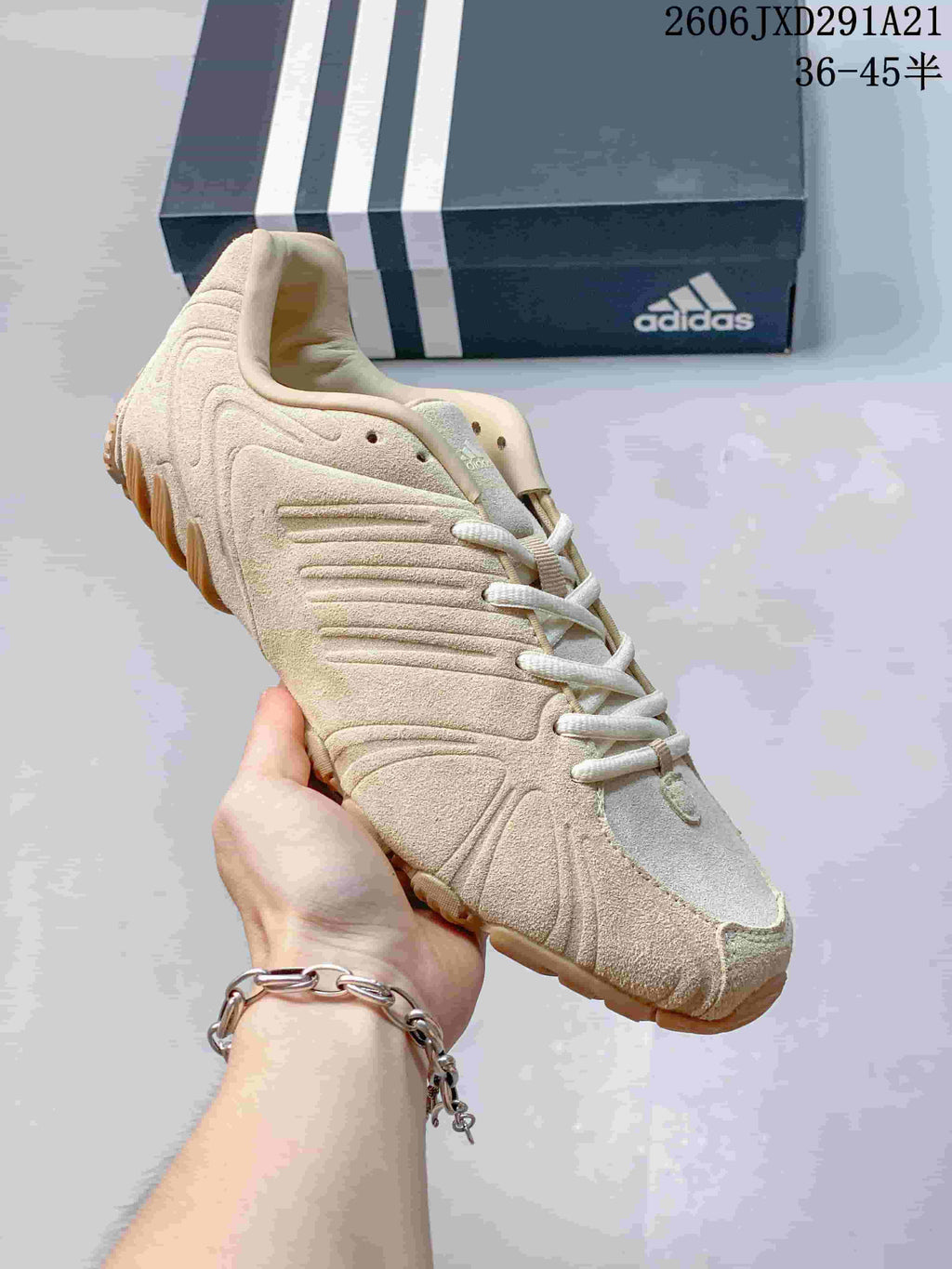 Cream adidas Ghost Sprint sneaker shown close up with an adidas shoe box in the background.