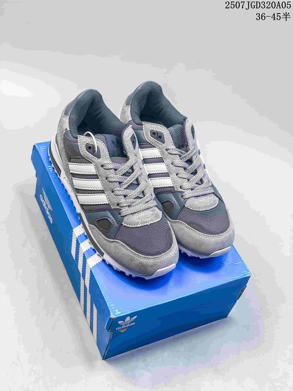 Pair of grey adidas ZX 750 sneakers on a blue shoe box; image text shows 36–45.5.