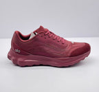 Side view of burgundy alo Runner sneakers showing the textured upper, lace closure, and layered sole.