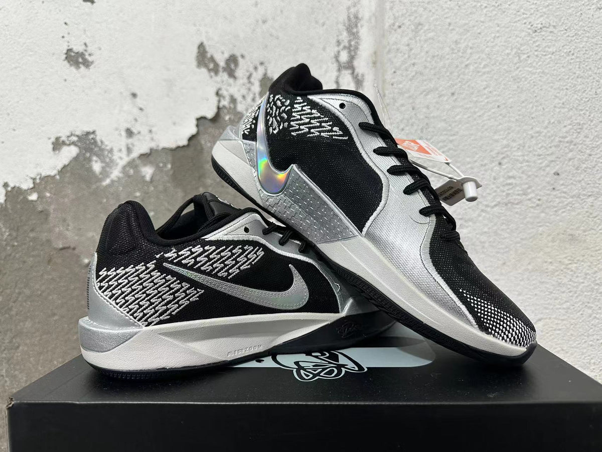Pair of black and silver basketball shoes shown from the side and at an angle.