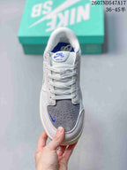 Top view of the Nike SB Force 58 sneaker showing the padded tongue, white laces, perforated grey toe and blue accents.