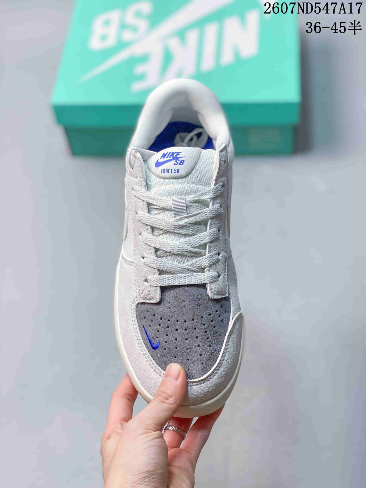 Top view of the Nike SB Force 58 sneaker showing the padded tongue, white laces, perforated grey toe and blue accents.