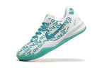 White and teal Kobe 8 Protro shoe, angled side view.