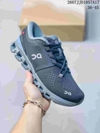 Close-up side view of a black and gray On Cloud X 4 sneaker.