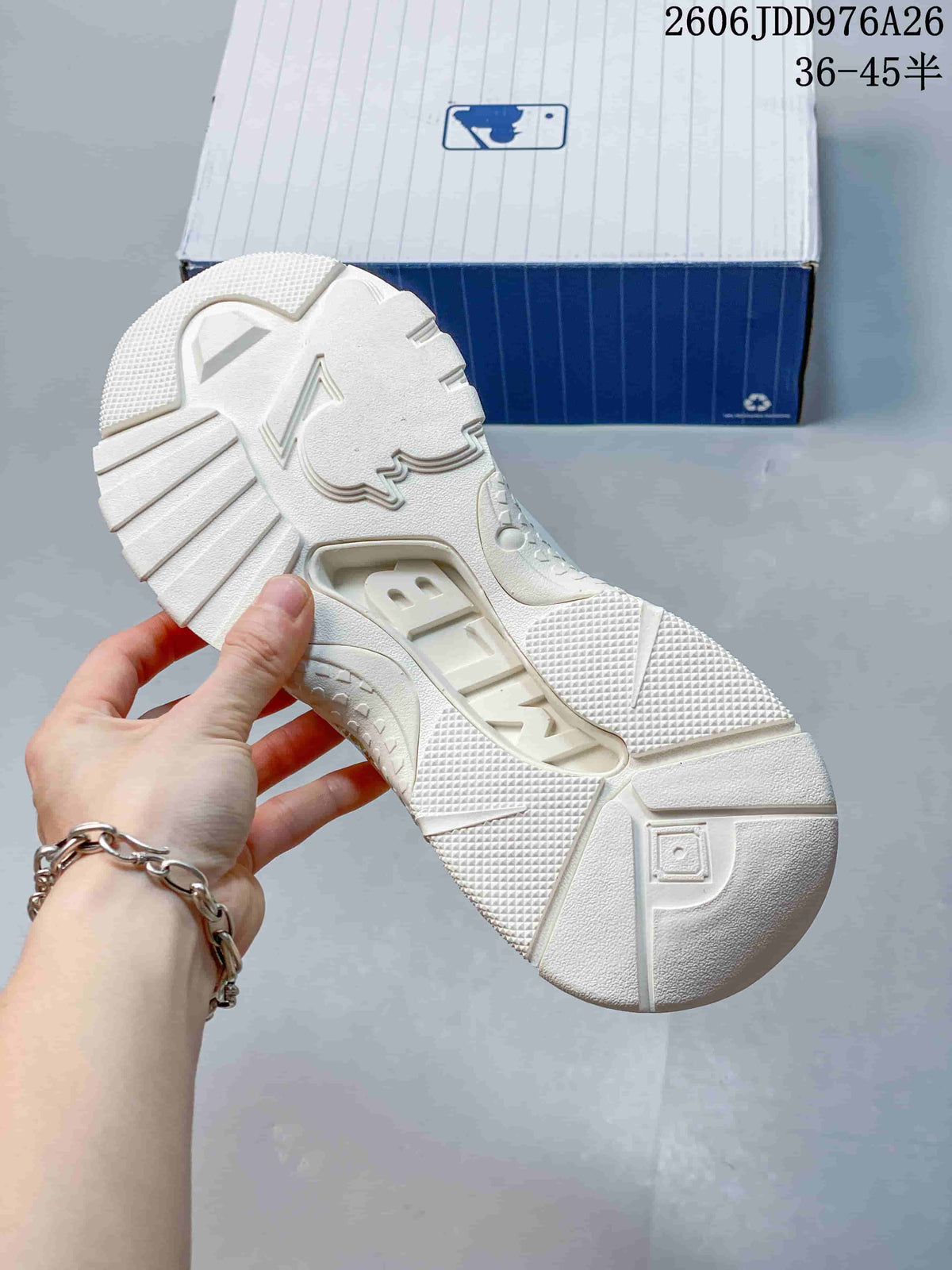Underside view showing the white segmented rubber outsole and textured traction areas.