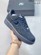 Angled side view of a black Nike Air Force 1 low-top sneaker showing the tonal Swoosh, heel AIR detail, and textured outsole.