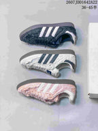 Side profiles of black, white, and pink ruched adidas Samba OG colorways.