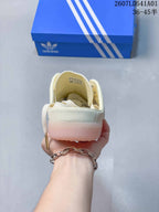 Rear view highlighting the open heel and pale pink-looking sole.