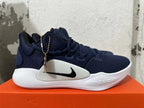 Side view of a navy blue Nike Zoom basketball shoe with white midsole