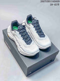 Pair of white and navy Kailas Fuga Ex 330 shoes displayed on a shoebox, with product code and size-range text visible above.