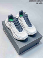 Pair of white and navy Kailas Fuga Ex 330 shoes displayed on a shoebox, with product code and size-range text visible above.