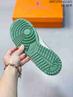 Close-up of the green rubber outsole showing its circular traction pattern and Nike branding.