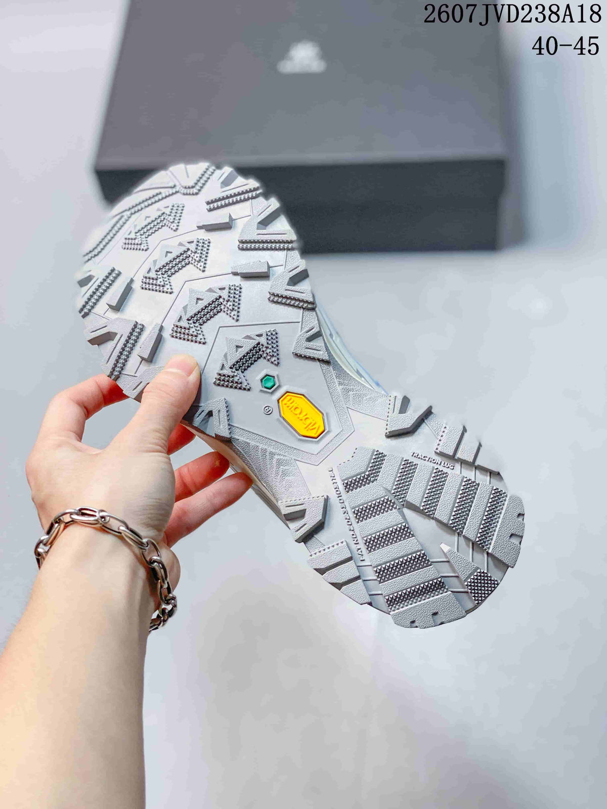 Close view of the hiking shoe outsole showing a deep lug pattern and visible Vibram branding.