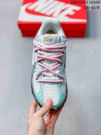 Top view of the Nike V5 RNR sneaker showing the white mesh-look toe area, mint overlays and pink laces.
